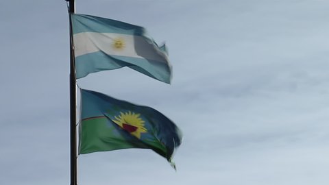 Flag of Argentina and Flag of Buenos Aires against Blue Sunset Sky. 