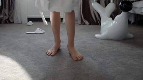 close-up of the legs of a child dancing on a carpet
