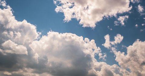 Timelapse of sky background with tiny fluffy clouds in sunny day