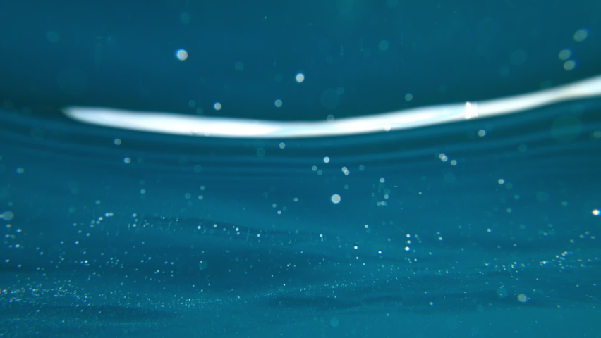 Ocean surface from below, camera sunken underwater, slow motion | Shutterstock HD Video #1090795155