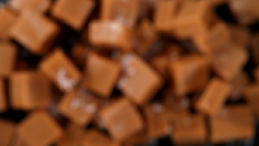 Super Slow Motion Shot of Salted Caramel Explosion Towards Camera Isolated on Black at 1000fps. Royalty-Free Stock Footage #1090797065