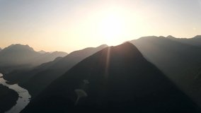 Aerial shot of mountains and sunrise  nature, river. drone video.