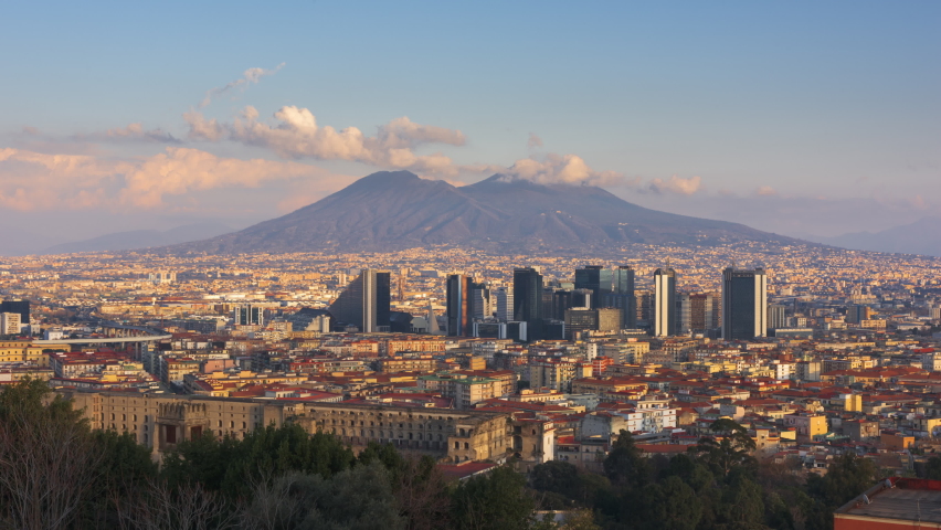 Naples, Italy with the financial district skyline under Mt. Vesuvius from afternoon till night.