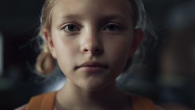Closeup face little scared girl in dark hall. Frightened preteen schoolgirl standing empty school corridor alone. Unhappy elementary age child feeling depressed looking camera. Loneliness concept. - Powered by Shutterstock - Get 15% off with code: PIKWIZARD15