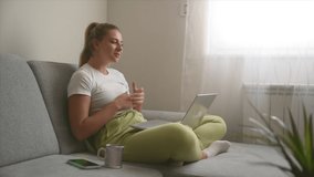 Young woman talking on video call with her psychotherapist doctor after online therapy sessions, happy that she is well and mentally health now after telemedicine conversations.
