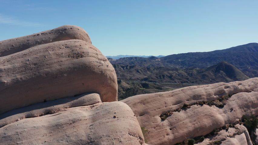 Slow reveal over Mormon Rock ridge line