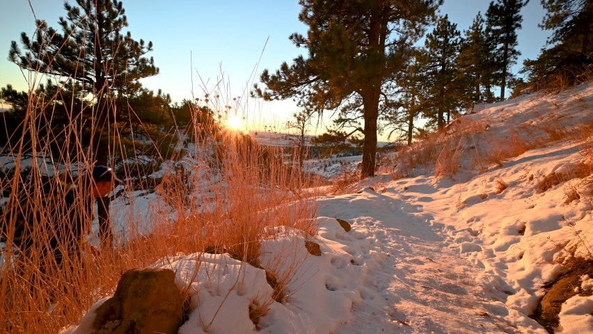 Hiking up a snow covered trail in Boulder Colorado