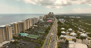 Aerial 5k video coastal scene Gulf Shores Condominiums on the beach