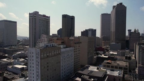 New Orleans , Louisiana , United States - 05 23 2022: Aerial View of Downtown Buildings, Towers and Skyscrapers on Sunny Day, Drone Shot