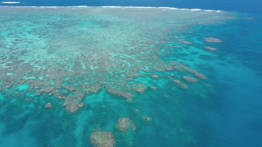 Great Barrier Reef landscape aerial of colorful coral and turquoise ocean, near Cairns, Queensland, Australia | Shutterstock HD Video #1090819919