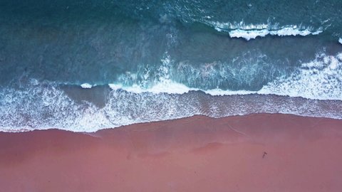 Professional video Aerial view of drone. Scene of top-down beach and seawater on sandy beach in summer. Nature and travel concept. Location Phuket Thailand 