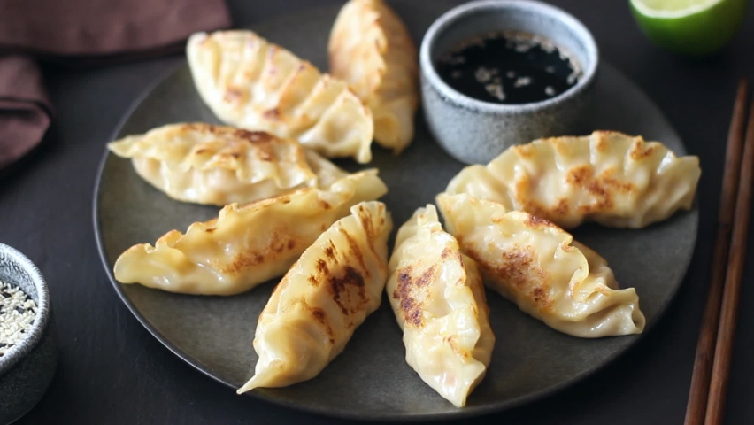 Fried dumplings with soy sauce. Gyoza. Healthy eating. Asian food. Royalty-Free Stock Footage #1090823117