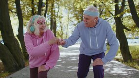 Athletic fitness senior elderly sport jogger man, woman training running cardio workout in summer park at morning. Old grandparents starting run race together. Active retired mature people motivation - Powered by Shutterstock - Get 15% off with code: PIKWIZARD15