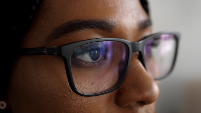 Close-up of a smart business woman wearing computer glasses looking at a computer screen, using the Internet, reading information, watching, working on the Internet. Royalty-Free Stock Footage #1090838199