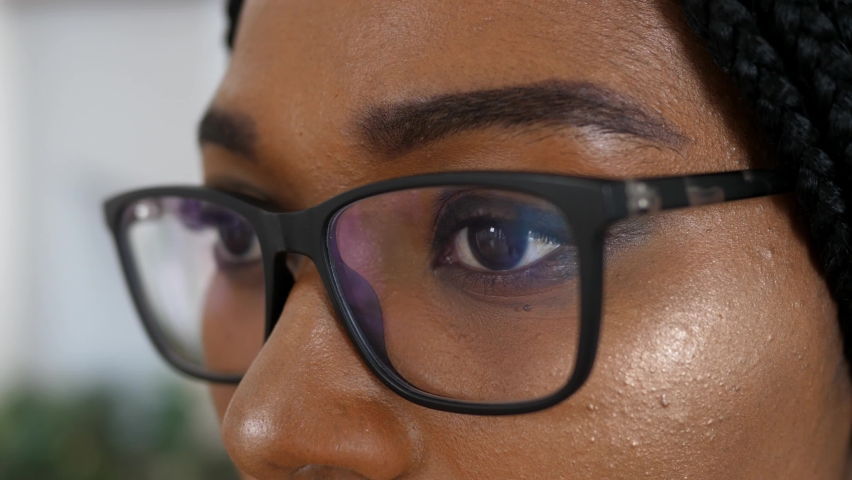Close-up of a smart business woman wearing computer glasses looking at a computer screen, using the Internet, reading information, watching, working on the Internet. Royalty-Free Stock Footage #1090838201