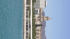 Vertical video of Malaga city with the harbour area of 