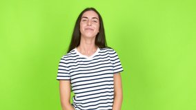 Young brunette woman pleading over isolated background. Green screen chroma key