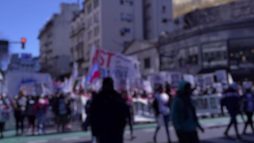 Blurred Protestors Marching on a Street in the Center of Buenos Aires, Argentina. 4K Resolution.