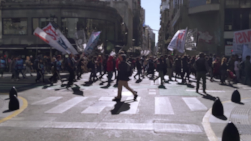 Blurred Protestors Marching on a Street in the Center of Buenos Aires, Argentina. 4K.