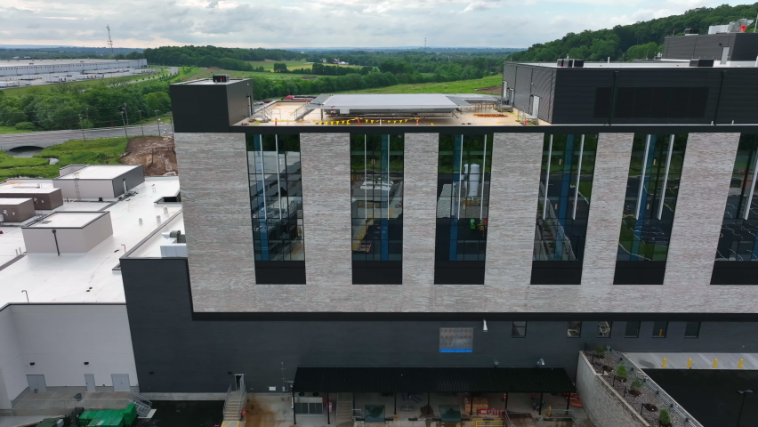 Penn State Health system hospital in Lancaster Pennsylvania USA. Brand new building under construction. Aerial truck shot. Royalty-Free Stock Footage #1090851825