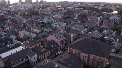 Aerial dolly shot along a French Quarter street in New Orleans at sunset. 4K
