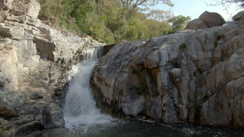 Yelapa Small Waterfall Flowing Over Rocky Cliffs On Tropical Forest In Jalisco, Mexico. Forward, Tilt-up