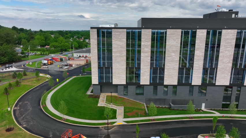 Brand new modern hospital building and university center in USA. Aerial truck shot of newly constructed facility.