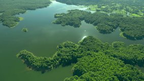 Video 4K Aerial view green forest and complete lake. Mae moh, Lampang, Thailand