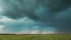 4K Sky During Rain Horizon Above Rural Wheat Landscape Field. Agricultural And Weather Forecast Concept. Storm, Thunder, thunderstorm, stormclouds, Time Lapse, Timelapse, Time-lapse. Countryside - Powered by Shutterstock - Get 15% off with code: PIKWIZARD15