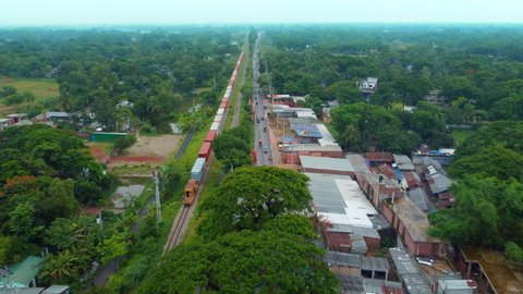 Aerial footage of running train through beautiful landscape in Bangladesh