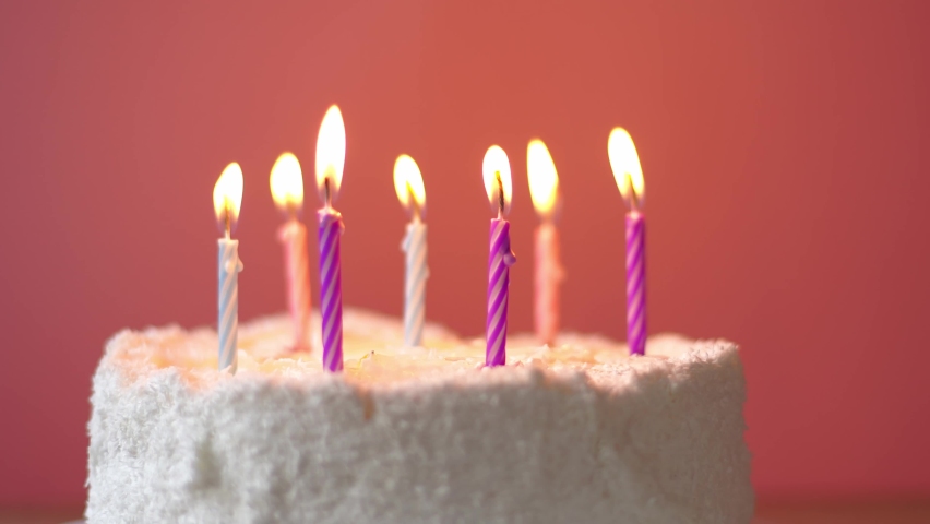 Burning candles are blown out on a cute girly birthday cake Royalty-Free Stock Footage #1090861199