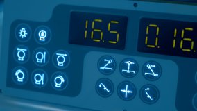 Digital display with changing digits on the panel with icons of industrial equipment functions. Closeup - Powered by Shutterstock - Get 15% off with code: PIKWIZARD15