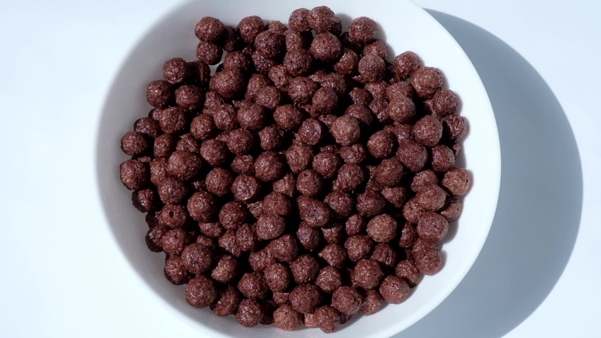 milk is poured into chocolate balls