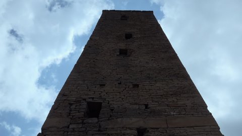 Bottom up view on ancient stone watchtower Goor in mountainous Dagestan