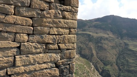 View of ancient stone wall of watchtower located in mountain village of Goor, Dagestan