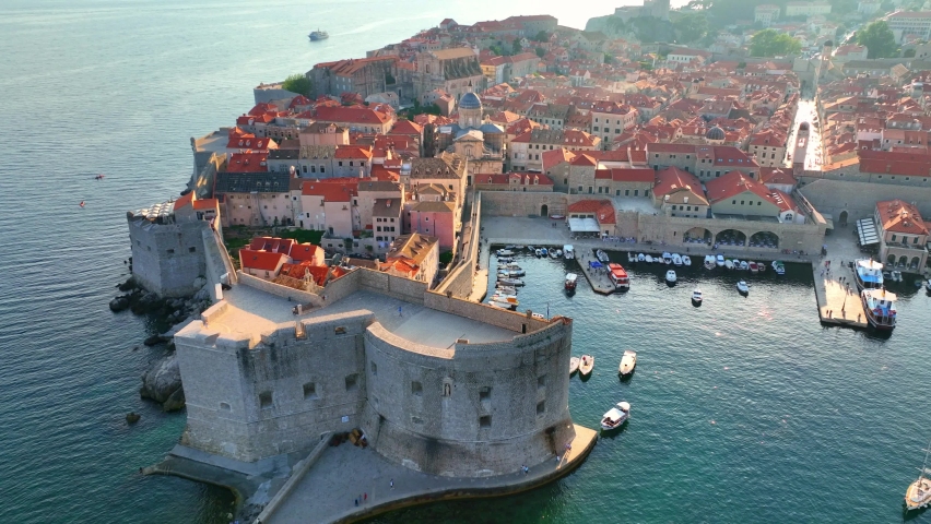 Dubrovnik old town at sunset, aerial view of historic city of Dubrovnik in Croatia, UNESCO World Heritage site in Croatia, famous tourist attraction in the Mediterranean. High quality 4k footage