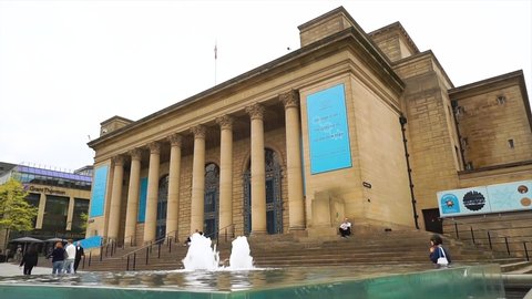 Sheffield, United Kingdom - April 02, 2022: A 4K Video of the Sheffield City Hall with the water fountain in the Foreground.