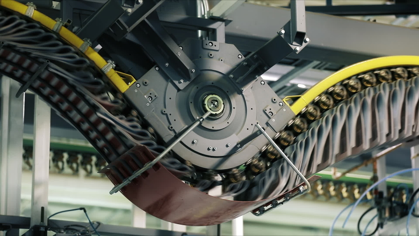 Daily newspaper in a process of offset printing as seen from below. The plates transfer their inked image too a rubber roller, which prints the page. High quality FullHD footage