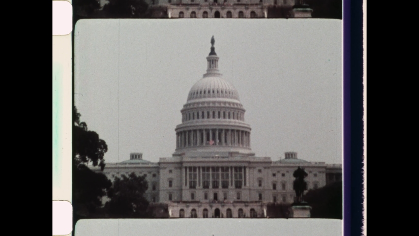 1980 Washington, DC. Zoom out from the Statue of Freedom to reveal The United States Capitol at the National Mall. The Capitol Building, is the meeting place of the United States Congress. 4K Overscan