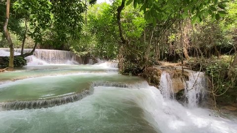 Kuang si waterfall falls in Luang Prabang Laos natural forest.