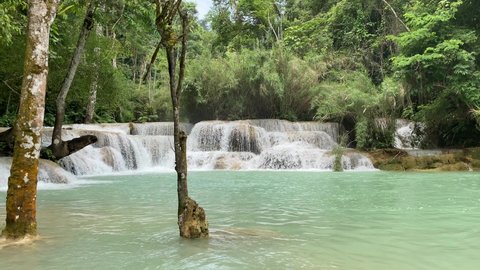 Kuang si waterfall falls in Luang Prabang Laos natural forest.