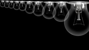 Shining light bulb with New Year 2023 and group of dark light bulbs in a row going from 2014 to 2022 isolated on black background. High quality 4k video.