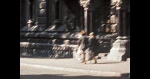 Woman on Europe old city street, sunny summer day. People walking near beautiful ancient colonial architecture. Central bank building, urban view. Vintage color film archive. Retro 1980s Kyiv Ukraine