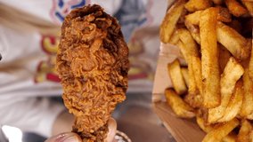 a woman pours sauce on a Crispy Fried Chicken Drumsticks