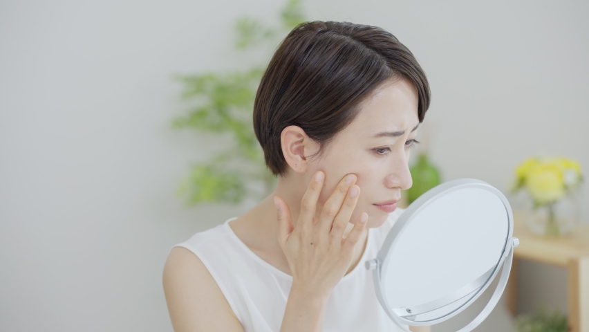 Asian woman suffering from skin problems Royalty-Free Stock Footage #1090888025