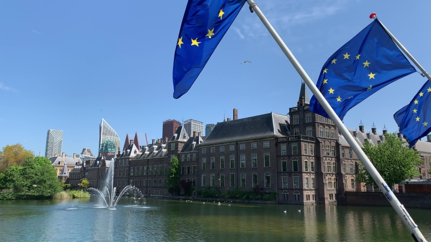 View of Binnenhof. Dutch government and office of Prime minister. Europen Union (EU) flags are waving in front. Running fountain. Den Haag skyline. The Hague, South Holland, Netherlands  | Shutterstock HD Video #1090890631
