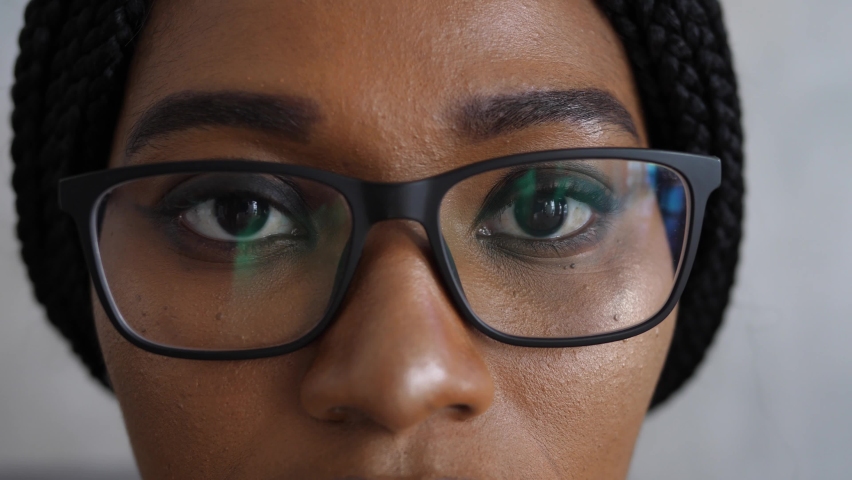Close-up of a smart business woman wearing computer glasses looking at a computer screen, using the Internet, reading information, watching, working on the Internet. Royalty-Free Stock Footage #1090894901