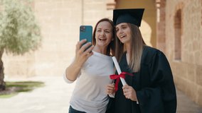 Two women mother and graduated daughter having video call at campus university