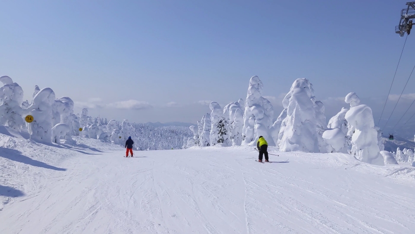 Skiing on the slope in snow monsters plateau (Zao, Yamagata, Japan) Royalty-Free Stock Footage #1090896143