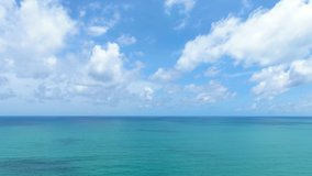 Blue sky clouds over ocean. Scenic sea waves aerial view wide drone over ocean sunny day summer United States. Beautiful panorama white clouds good video B roll, insert,Slow motion,Cinematic. 